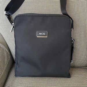 TUMI black leather trimmed messenger bag. Like new!